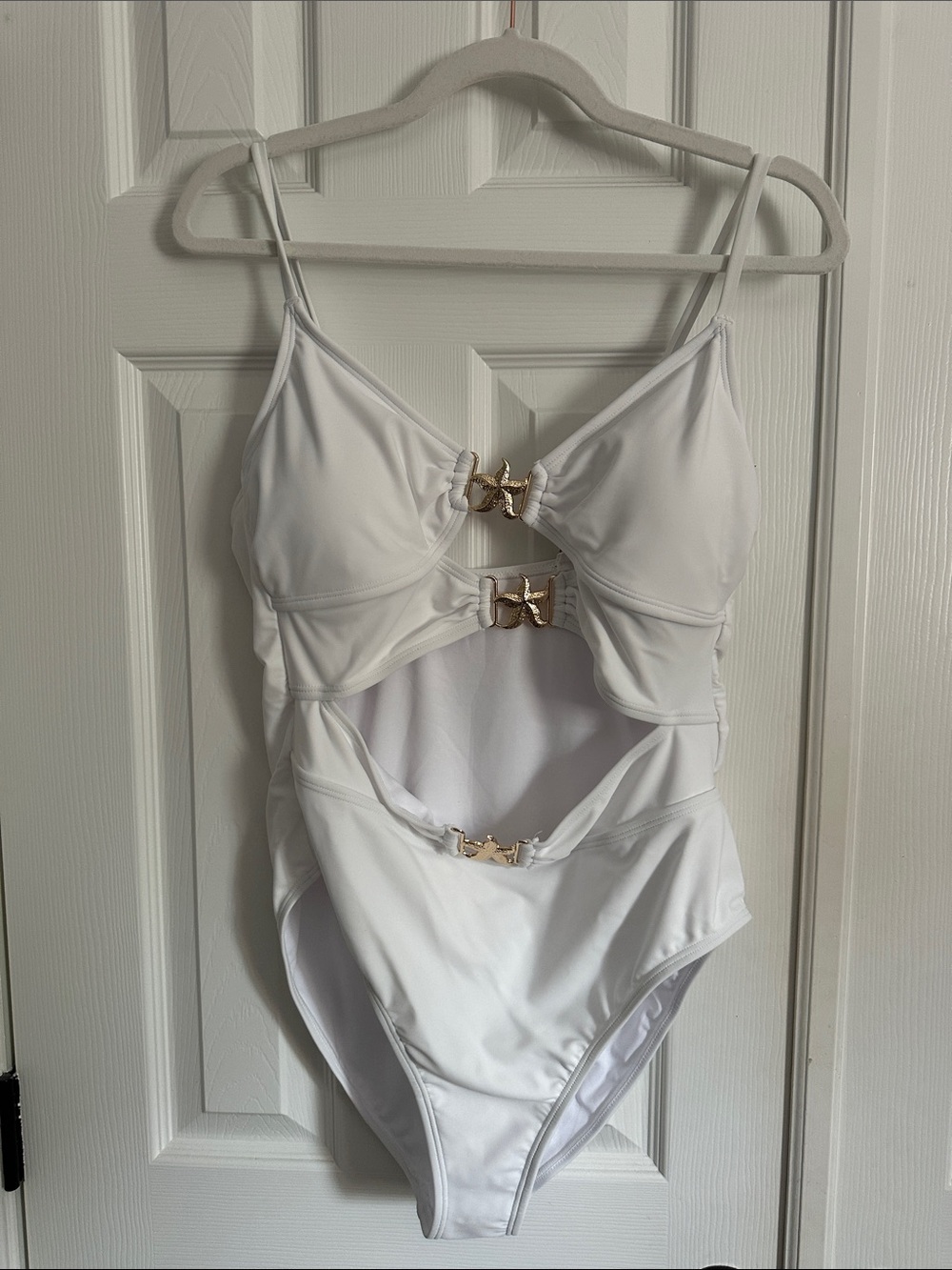 White One-Piece Swimsuit with Cutouts and Gold Buckle Accents